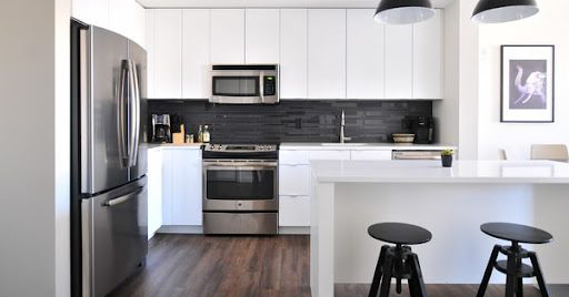 Stainless steel kitchen appliances in large modern home kitchen
